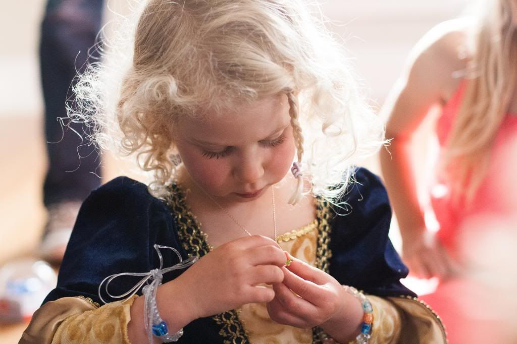 looking at her necklace