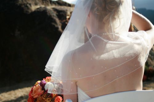 bride looking veil bouquet ominous swiss dot