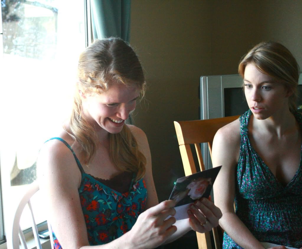 opening gifts at a bridal shower sisters