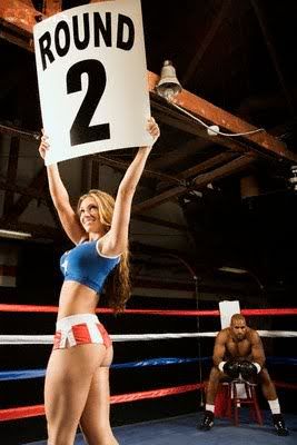 girl with round 2 sign